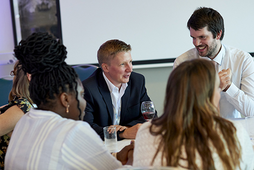 meeting attendees in lively discussion